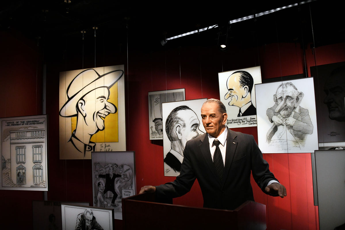 070 Wax figure and cartoon drawings of LBJ in his library.JPG